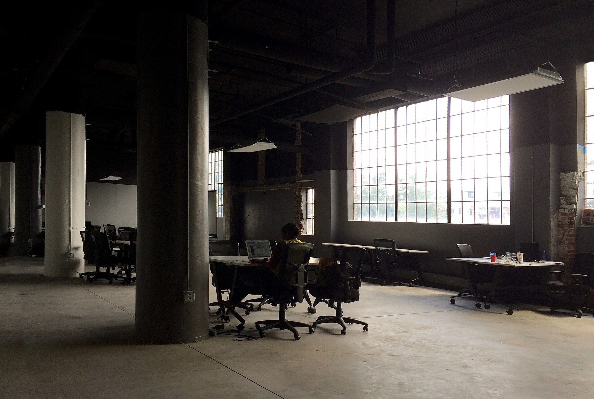 Lone office worker facing a demanding day at a desk