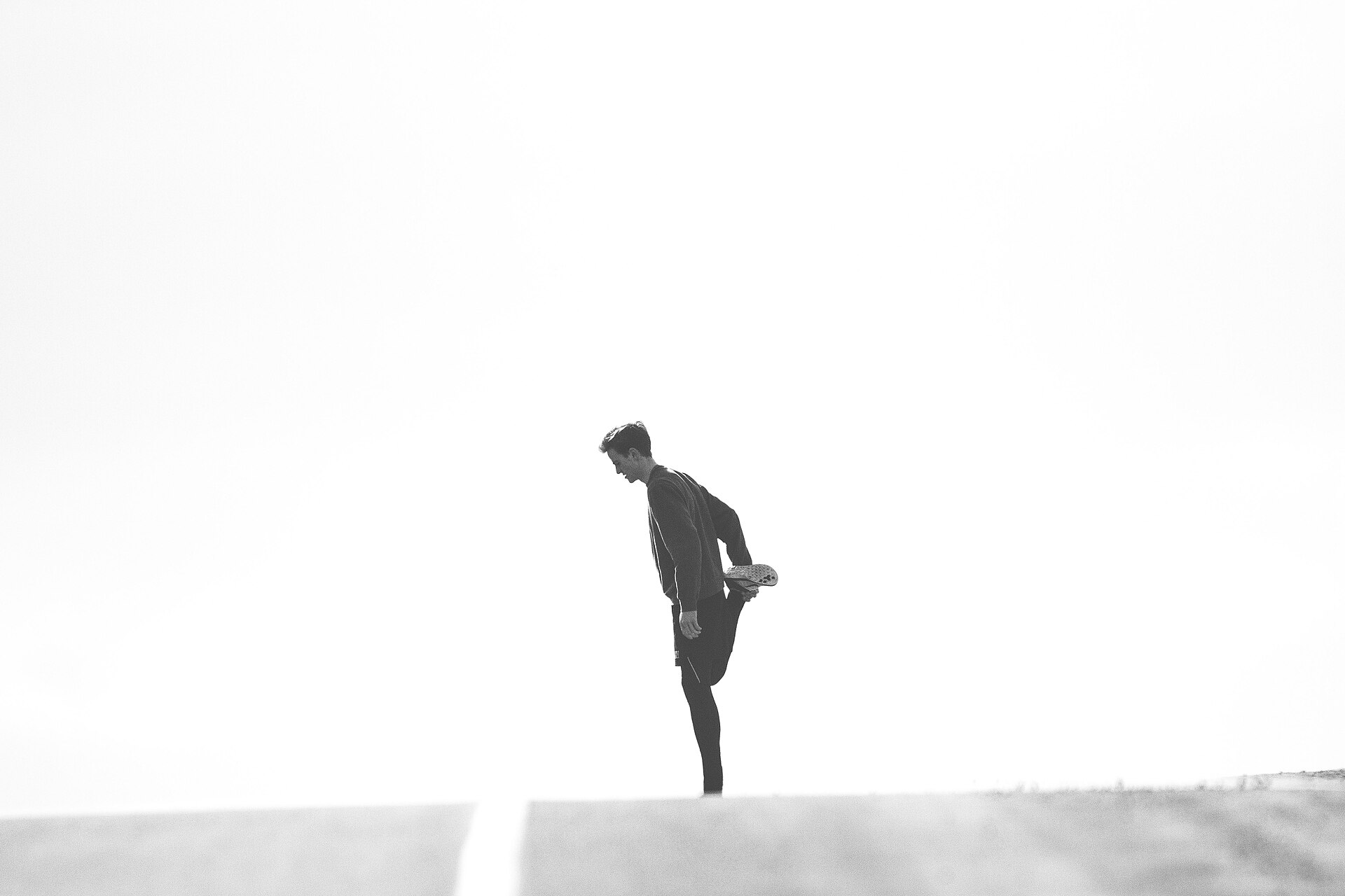 Runner stretching outdoors before exercise